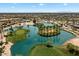 Picturesque aerial view of the golf course featuring lush green fairways and serene blue water features at 20900 N Vista Trl, Surprise, AZ 85387