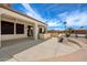 Large covered patio with outdoor kitchen area, perfect for entertaining and relaxing at 20900 N Vista Trl, Surprise, AZ 85387