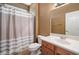 Cozy bathroom has a toilet, sink with vanity, and a shower with a curtain at 20900 N Vista Trl, Surprise, AZ 85387