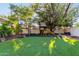 A backyard featuring a play structure, artificial turf and a basketball hoop at 2139 S Granite St, Gilbert, AZ 85295