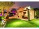 This outdoor oasis offers an outdoor kitchen, seating, green space, and a refreshing pool at 2139 S Granite St, Gilbert, AZ 85295