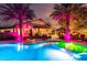 Outdoor living featuring a pool, covered patio with dining, and palm trees at 2139 S Granite St, Gilbert, AZ 85295