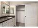Bathroom featuring granite countertops, a mirror, and a walk-in closet at 2139 S Granite St, Gilbert, AZ 85295