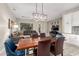 Open concept dining area with modern pendant lighting and a view of the living room at 2139 S Granite St, Gilbert, AZ 85295