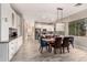 Bright dining area adjacent to the kitchen with modern lighting and stainless steel appliances at 2139 S Granite St, Gilbert, AZ 85295