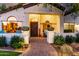 Inviting home entrance showcasing a charming walkway, potted plants, and cozy seating at 2139 S Granite St, Gilbert, AZ 85295