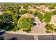 Aerial view of home featuring lush landscaping, mature trees, and a well-manicured front lawn at 2139 S Granite St, Gilbert, AZ 85295