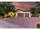 Well-maintained home featuring an expansive driveway and a lush, landscaped front yard at 2139 S Granite St, Gilbert, AZ 85295