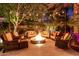 Cozy outdoor seating area with a fire pit surrounded by comfortable chairs and couches at 2139 S Granite St, Gilbert, AZ 85295