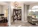 Home's foyer features an eye-catching chandelier, unique front door, and natural light at 2139 S Granite St, Gilbert, AZ 85295