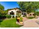Charming single-story home featuring manicured landscaping, mature trees, and a welcoming brick walkway at 2139 S Granite St, Gilbert, AZ 85295