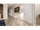 Bright hallway featuring wood wall decor and double doors for additional storage space at 2139 S Granite St, Gilbert, AZ 85295