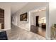 Inviting hallway with wood accents, flowing into a bright living space with hardwood floors at 2139 S Granite St, Gilbert, AZ 85295