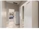 Hallway view of a bedroom and built-in closet with mirrored doors at 2139 S Granite St, Gilbert, AZ 85295