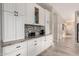 Bright kitchen featuring white cabinets, granite countertops, and stainless steel appliances at 2139 S Granite St, Gilbert, AZ 85295