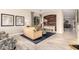This home's living room has a decorative fireplace, neutral furniture, and light hardwood floors at 2139 S Granite St, Gilbert, AZ 85295