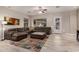Spacious living room featuring a comfortable sectional sofa, stylish rug, and ample natural light at 2139 S Granite St, Gilbert, AZ 85295
