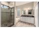 Beautiful main bathroom featuring dual sinks, large shower, soaking tub, and neutral finishes at 2139 S Granite St, Gilbert, AZ 85295