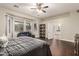 Spacious primary bedroom suite featuring wood floors, large windows, and access to the bathroom at 2139 S Granite St, Gilbert, AZ 85295
