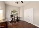 Bright home office space featuring wood floors, neutral paint, and a window view at 2139 S Granite St, Gilbert, AZ 85295