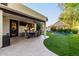 Outdoor dining area next to an outdoor kitchen and backyard trampoline offering a great space for entertaining and relaxation at 2139 S Granite St, Gilbert, AZ 85295