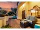Cozy front patio featuring comfortable seating and a view of the landscaped yard at 2139 S Granite St, Gilbert, AZ 85295