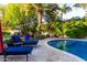 Backyard pool with lounge chairs, lush landscaping, and a tranquil setting for relaxation and entertainment at 2139 S Granite St, Gilbert, AZ 85295