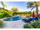 Beautiful backyard pool with lush landscaping, lounge chairs, and a serene resort-like setting at 2139 S Granite St, Gilbert, AZ 85295