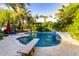 Sparkling pool with diving board, surrounded by lush greenery, creating a perfect backyard oasis at 2139 S Granite St, Gilbert, AZ 85295