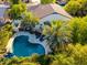 Aerial view of a freeform pool and lounge area with patio furniture in a private backyard at 2139 S Granite St, Gilbert, AZ 85295