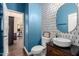 Stylish powder room with modern fixtures, vessel sink, and designer tile accent wall at 2139 S Granite St, Gilbert, AZ 85295