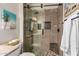 Beautiful shower with pebble floor, built-in niche, and glass door at 2139 S Granite St, Gilbert, AZ 85295