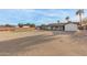 View of the backyard and putting green that provides an amazing outdoor space at 22312 W Hammond Dr, Buckeye, AZ 85326