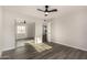 Bedroom with mirrored closet doors, a ceiling fan, and plenty of natural light showcasing modern features at 22312 W Hammond Dr, Buckeye, AZ 85326