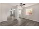 Bedroom boasts ample natural light and mirrored closet doors, flowing seamlessly into the adjacent living area at 22312 W Hammond Dr, Buckeye, AZ 85326