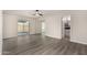Bright bedroom features a ceiling fan, new flooring and a sliding door leading to the backyard at 22312 W Hammond Dr, Buckeye, AZ 85326