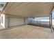 Spacious carport attached to a home with a garage and gate for added privacy at 22312 W Hammond Dr, Buckeye, AZ 85326