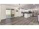 Charming kitchen with white cabinets, stainless steel appliances, and access to backyard at 22312 W Hammond Dr, Buckeye, AZ 85326