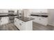 Modern kitchen featuring granite countertops, stainless appliances, and a central island at 22312 W Hammond Dr, Buckeye, AZ 85326