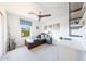 This bedroom features a wood ceiling fan, window with blinds, and built in shelves at 29966 N 72Nd Dr, Peoria, AZ 85383