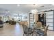 Light-filled dining area with a glass table, decorative lighting, and open access to living spaces at 3029 E Elm St, Phoenix, AZ 85016