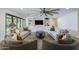 Spacious living room featuring a ceiling fan, comfortable seating, and custom built-ins at 3029 E Elm St, Phoenix, AZ 85016