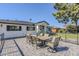 Spacious outdoor patio with a stone table and chairs overlooking the front yard at 3029 E Elm St, Phoenix, AZ 85016