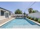 Backyard pool area with a lounge area and privacy fencing at 3029 E Elm St, Phoenix, AZ 85016