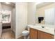 Practical bathroom layout with a single vanity, toilet, and access to the bedroom and the shower at 30587 N Maple Chase Dr, San Tan Valley, AZ 85143