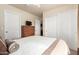Bedroom showcasing ample closet space, white trim, and neutral walls at 30587 N Maple Chase Dr, San Tan Valley, AZ 85143