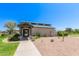 Community clubhouse with desert landscaping, featuring a covered entrance and convenient access for residents at 30587 N Maple Chase Dr, San Tan Valley, AZ 85143