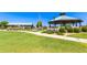 Lush green lawn leads to a large gazebo with a covered picnic area, perfect for community gatherings and outdoor events at 30587 N Maple Chase Dr, San Tan Valley, AZ 85143