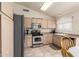 Functional kitchen with plentiful countertops, stainless steel appliances, and tile flooring at 30587 N Maple Chase Dr, San Tan Valley, AZ 85143