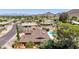 Aerial view of a charming neighborhood featuring homes with sparkling backyard pools at 3131 E Las Rocas Dr, Phoenix, AZ 85028